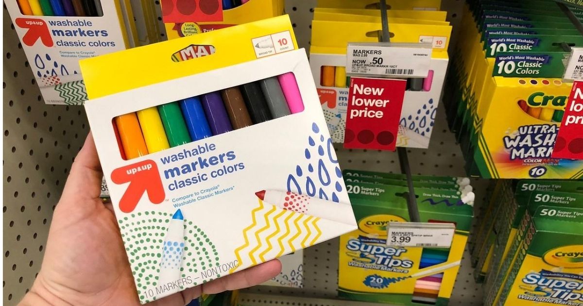 box of washable markers in woman's hand