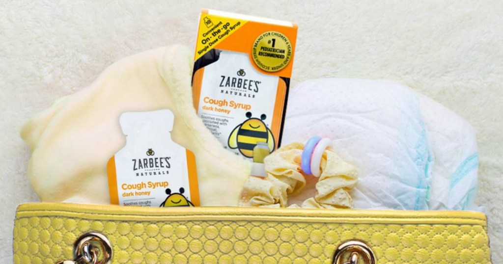 Zarbee's Cough Syrup box in purse with diapers and blanket