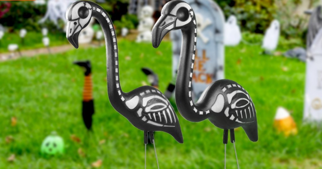 two Zombie flamingos in a yard