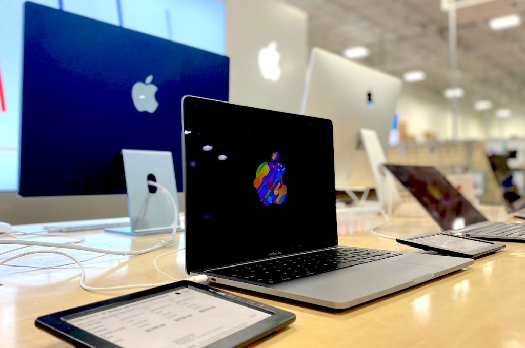 close up of row of apple laptops