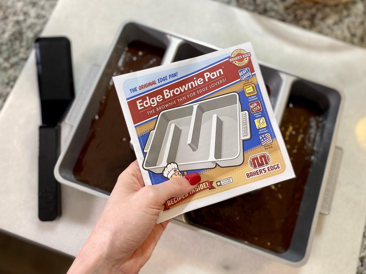 hand holding recipe book from Baker's Edge Brownie Pan