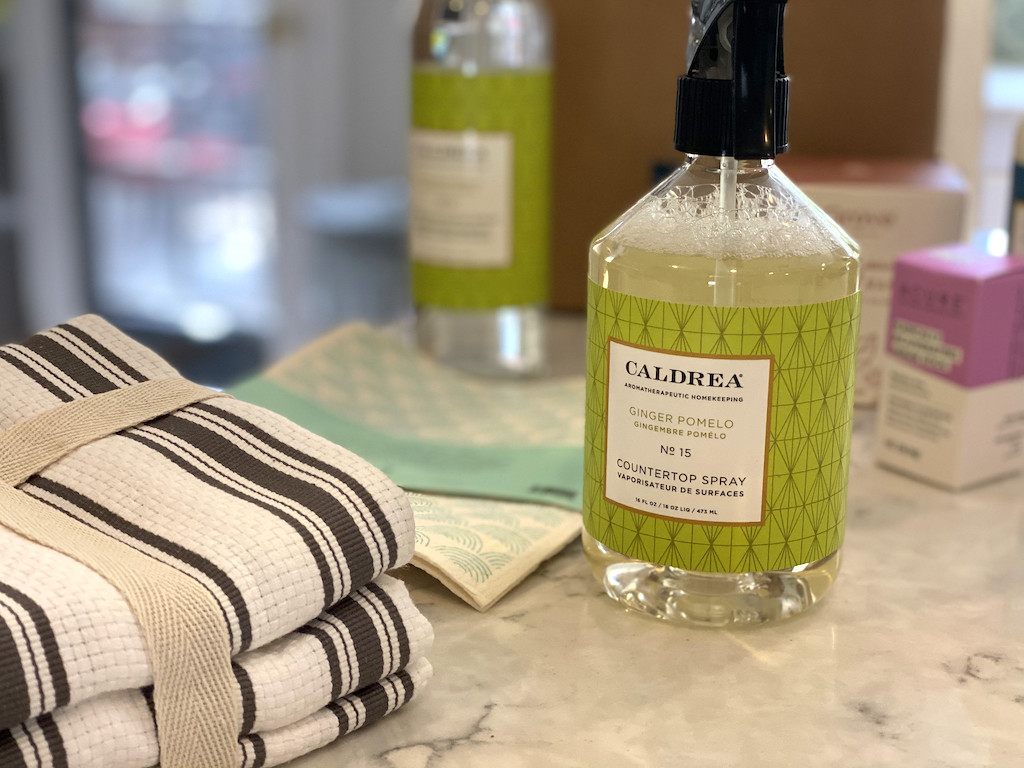 Caldrea countertop spray with towels on counter