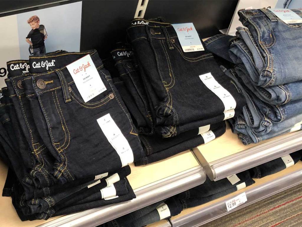 boys jeans folded and stacked on display in store