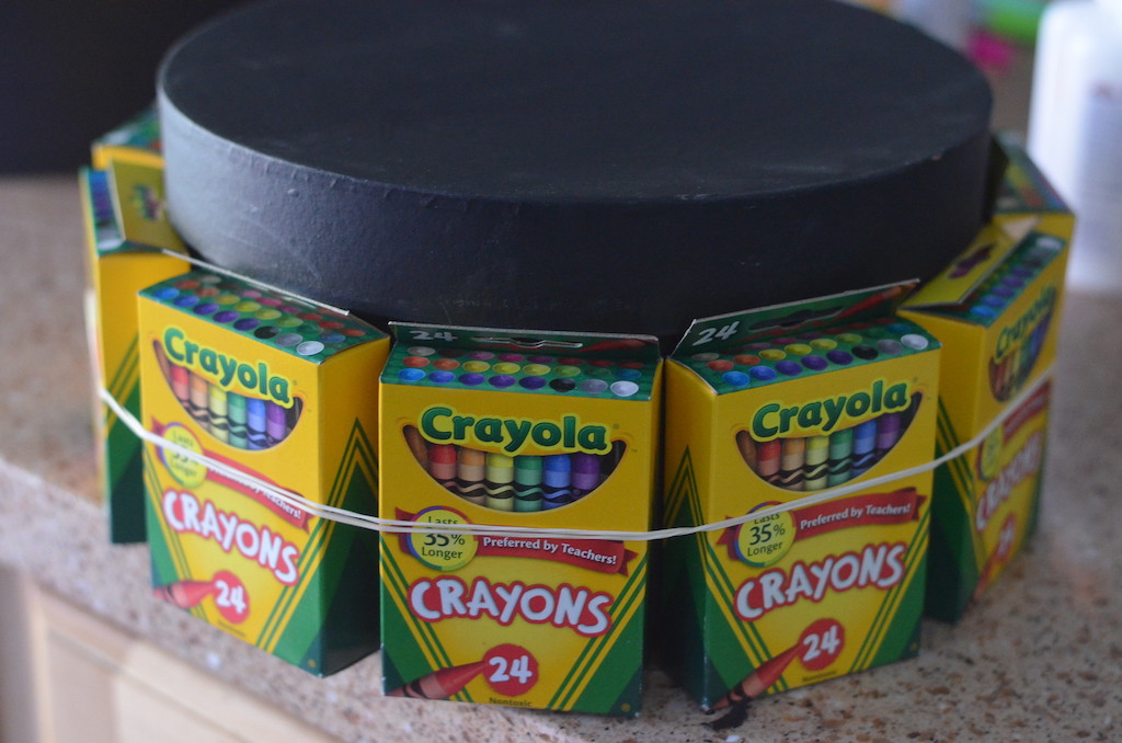 Crayola crayons packs attached to box with rubber bands