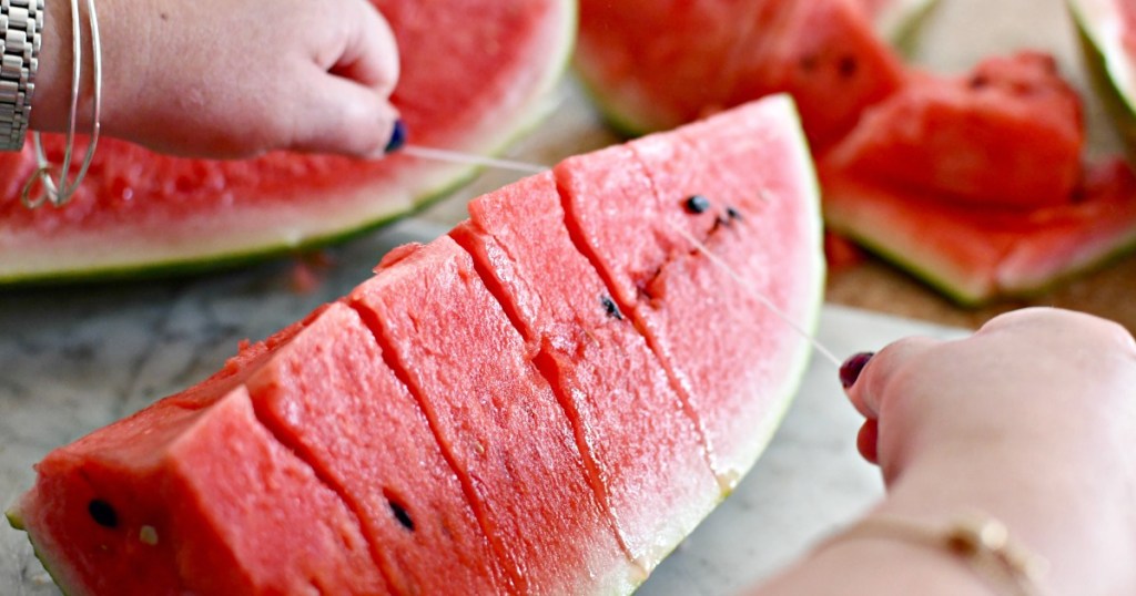 cutting watermelon with floss