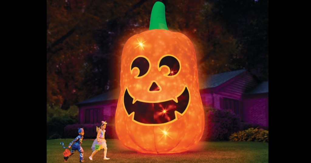 giant light up pumpkin inflatable in front yard 