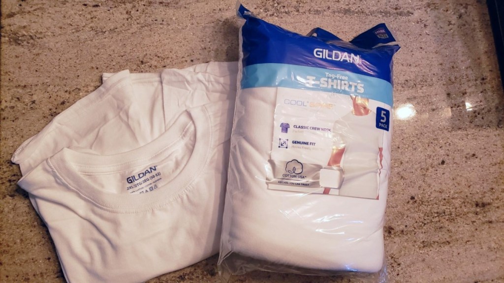 package of white T-shirts on counter
