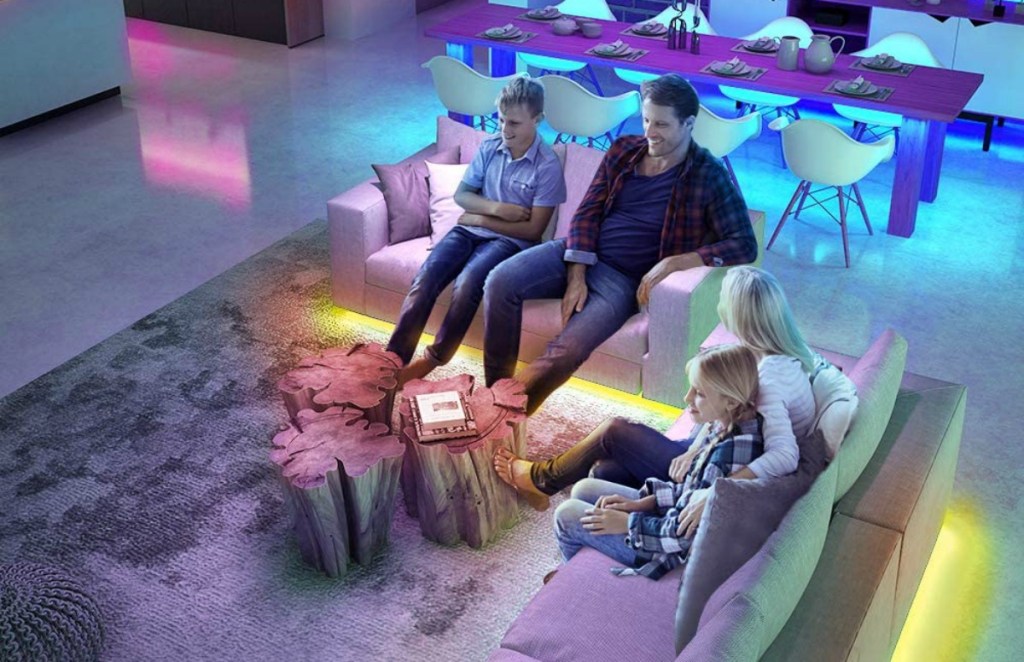 people in living room with colorful LED lights