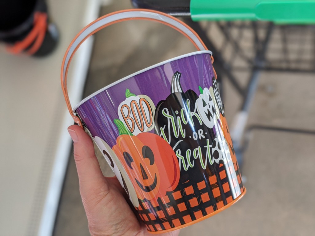 hand holding Halloween theme bucket