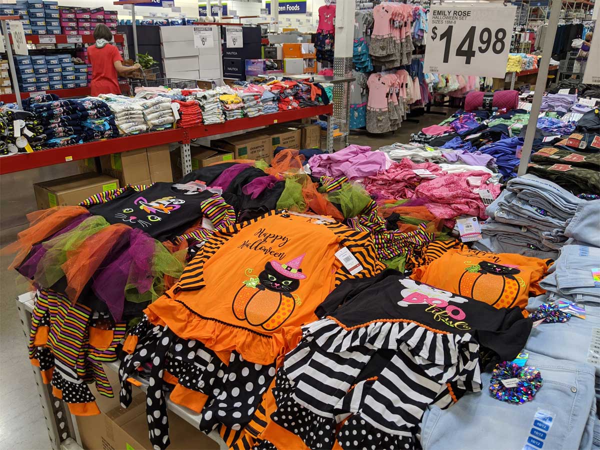 girls halloween outfits on table