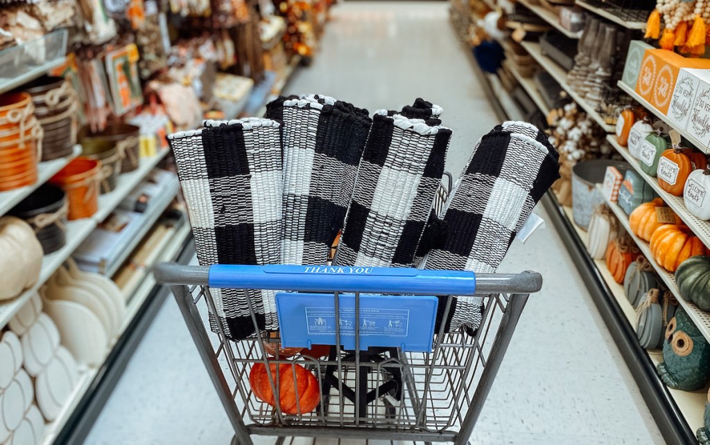 black and white checked rugs in top of cart