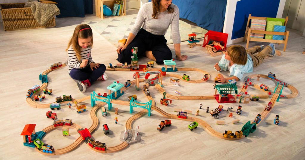 kids in room playing with Thomas & Friends train set