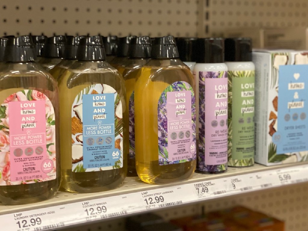 laundry products on store shelf by price tags