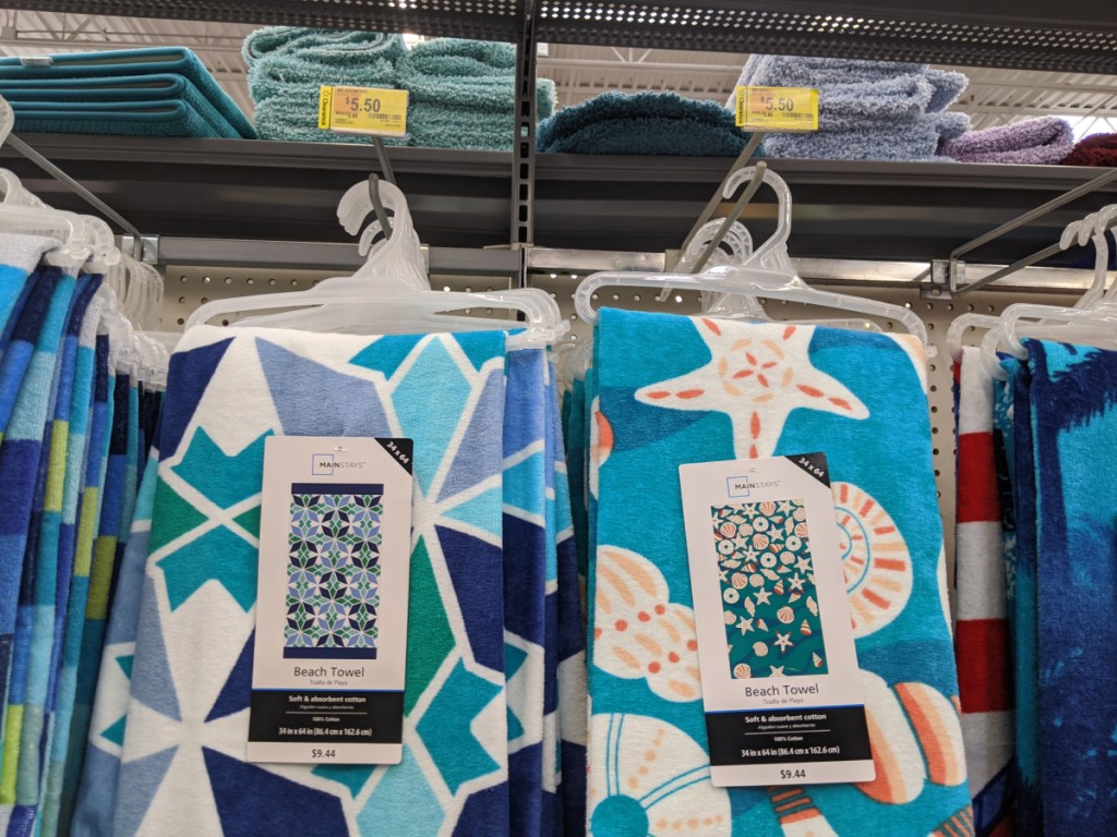 blue and white towels hanging in store display