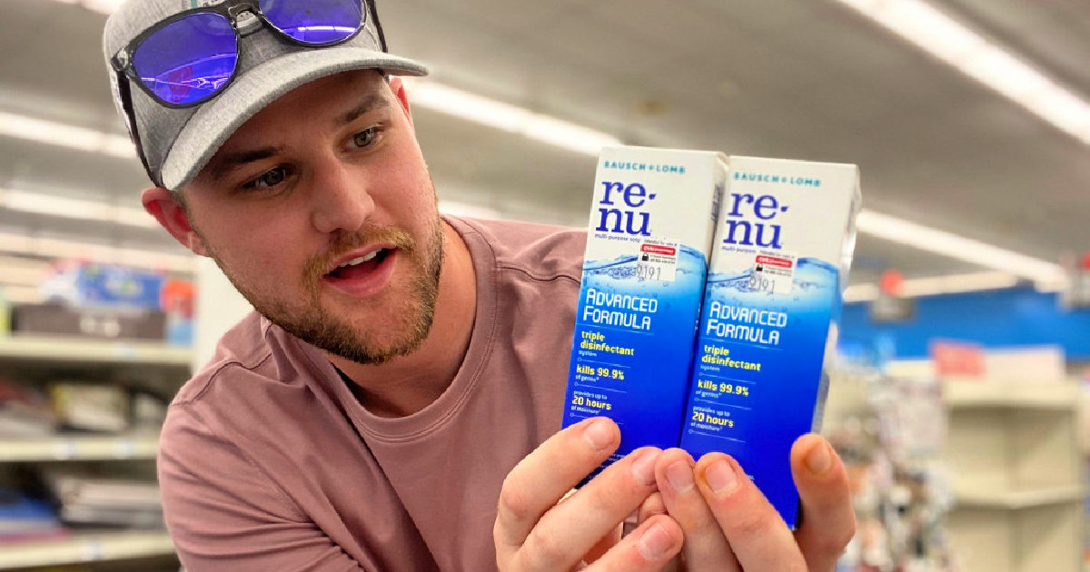 man holding bottles of renu contact solution