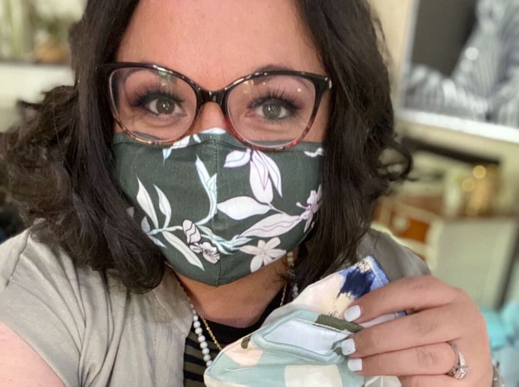 woman wearing floral mask on face with eyeglasses