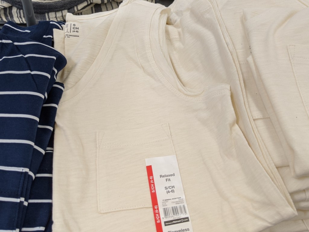 pile of tank tops on store display