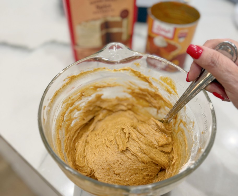 mixing pumpkin bars in a bowl