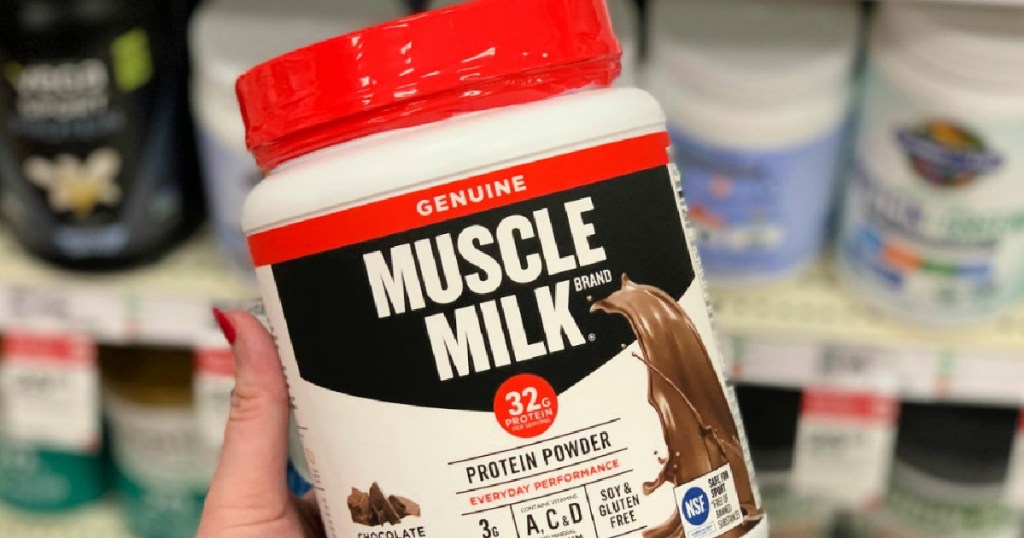 muscle mik protein powder in person's hand