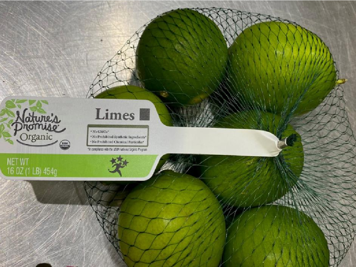 bag of limes with large tag in mesh bag