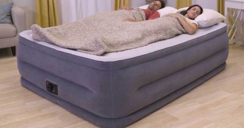 people laying on a large air mattress