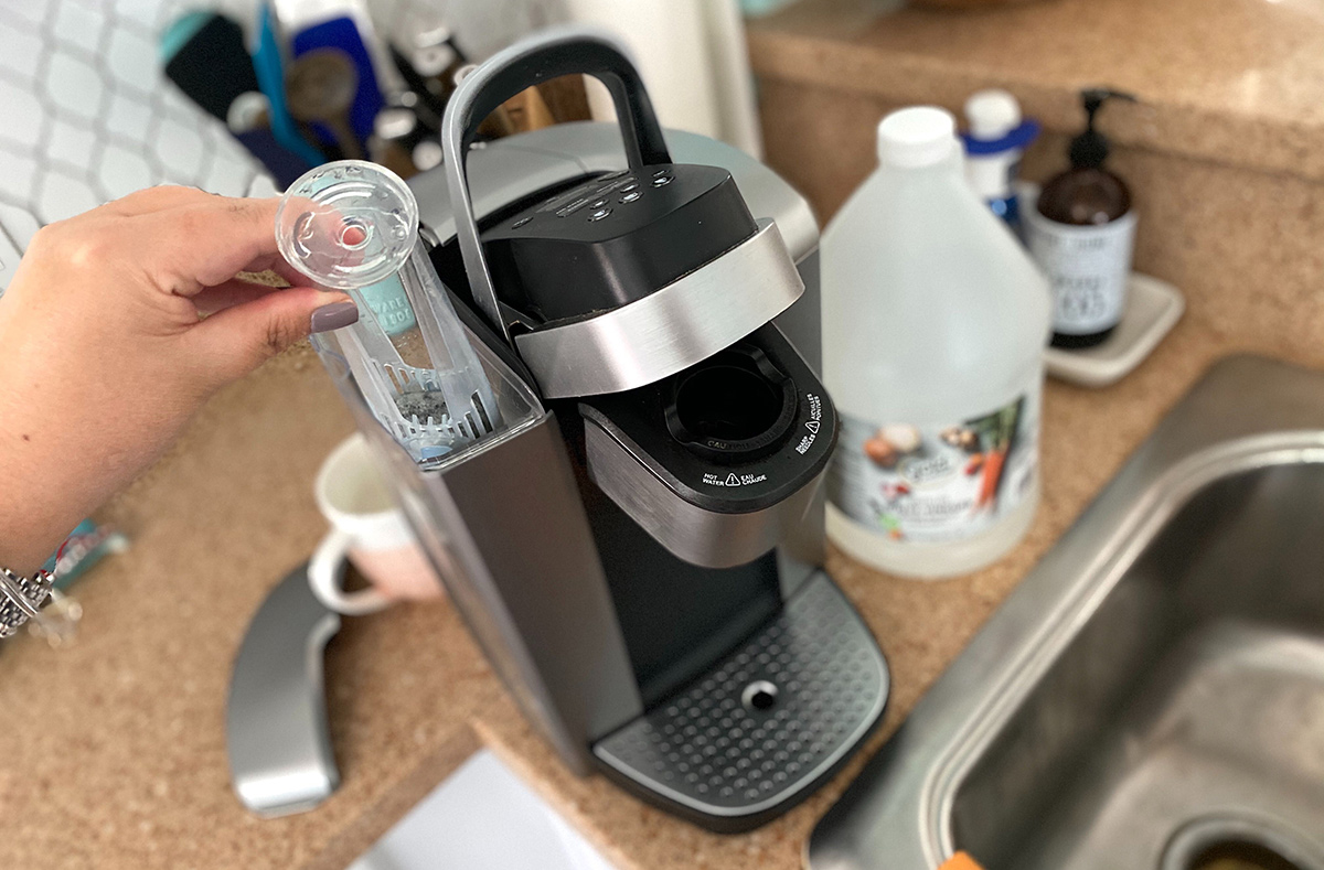 removing the water filter from the reservoir on keurig machine