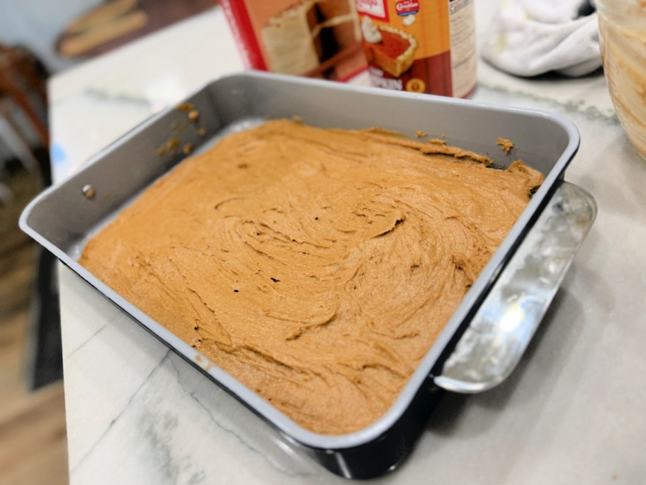 spreading mixture into a baking dish 