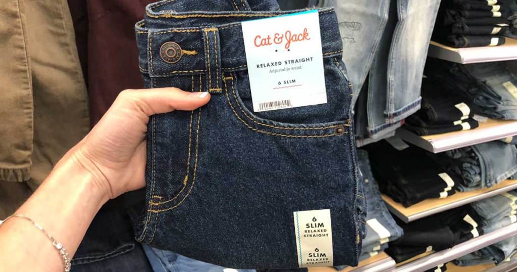 hand holding pair of cat and jack jeans