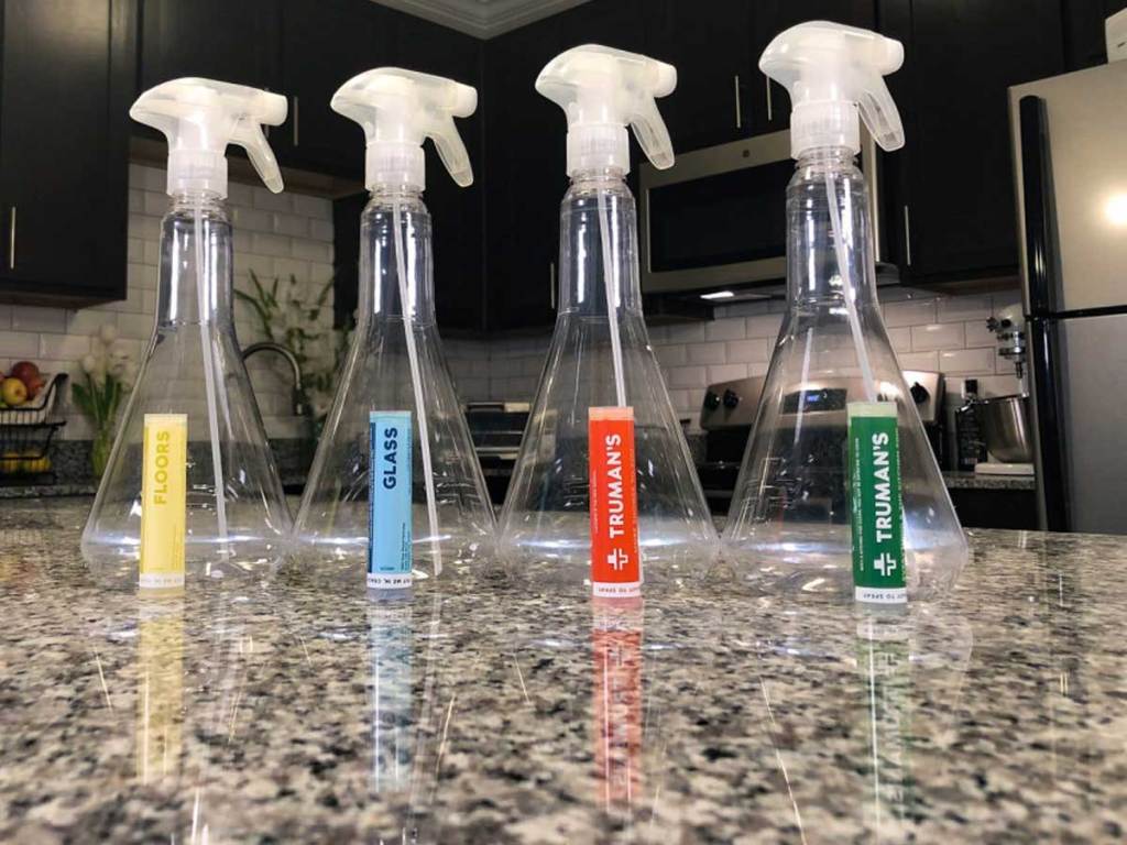 truman's spray bottles and cleaning concentrates on a kitchen counter