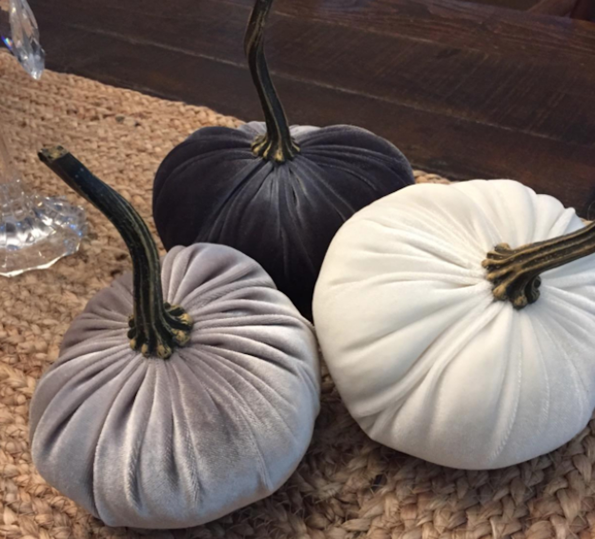 gray and white velvet pumpkins on jute table