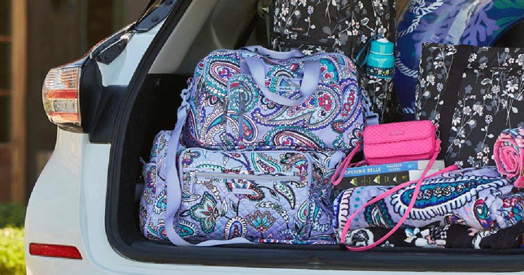 multiple vera bradley travel bags in trunk