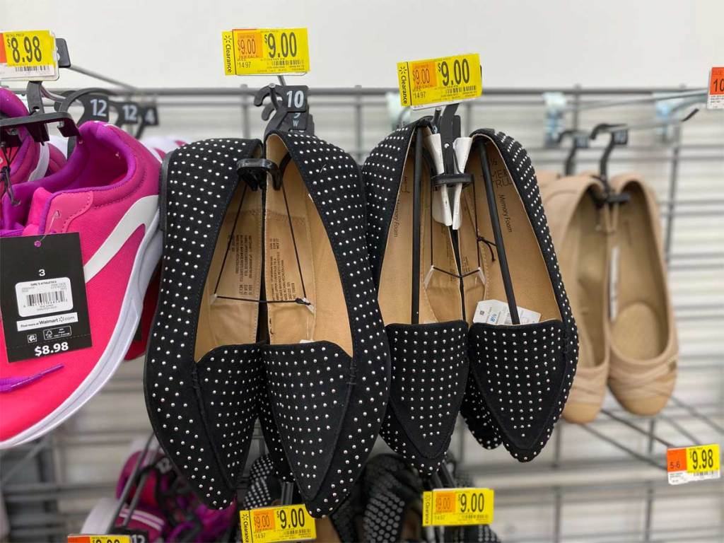 women's black flats shoes on display in store
