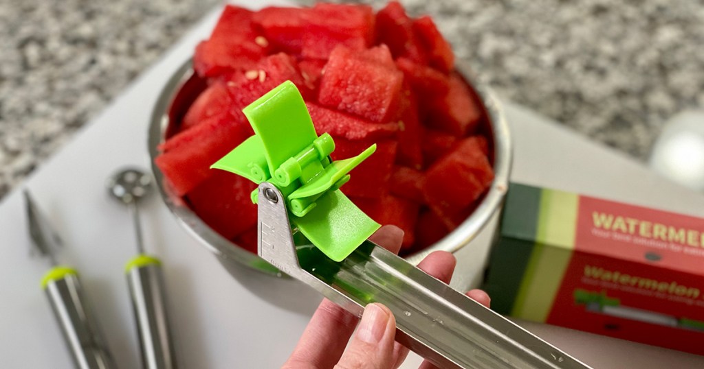 watermelon windmill slicer gadget in front of bowl of watermelon