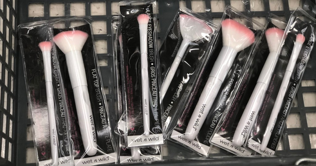 multiple wet n wild makeup brushes sitting in a small shopping basket