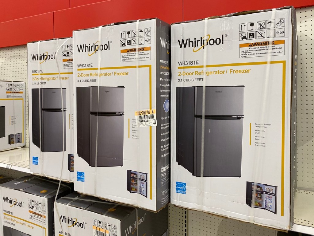 boxes with small refrigerators on them in a store