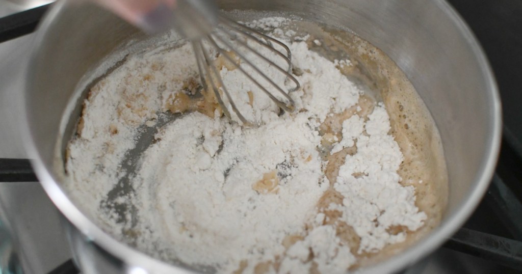 whisking butter and flour in a saucepan