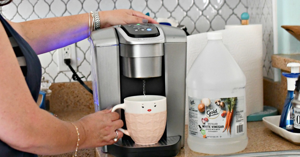 Here S How To Clean A Keurig Coffee Maker Using White Vinegar   Woman Cleaning A Keurig Machine With Vinegar  