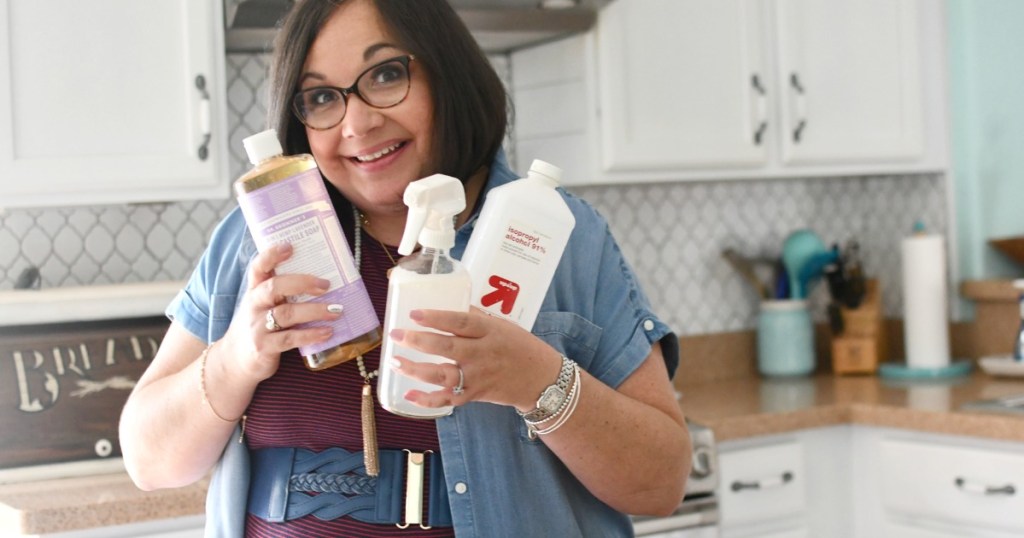 woman holding ingredients to make DIY granite cleaner