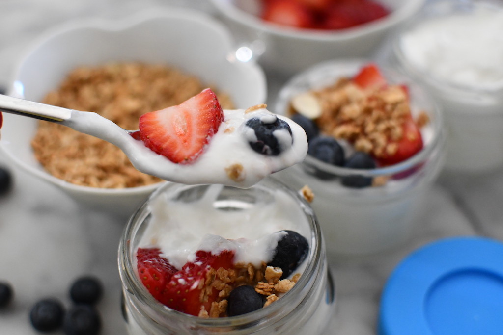 homemade yogurt on spoon with berries