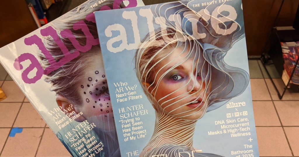 hand holding two allure magazines in store