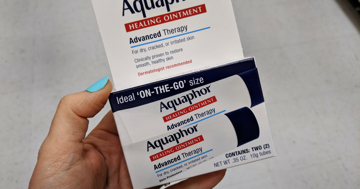 hand holding Aquaphor Healing Ointment