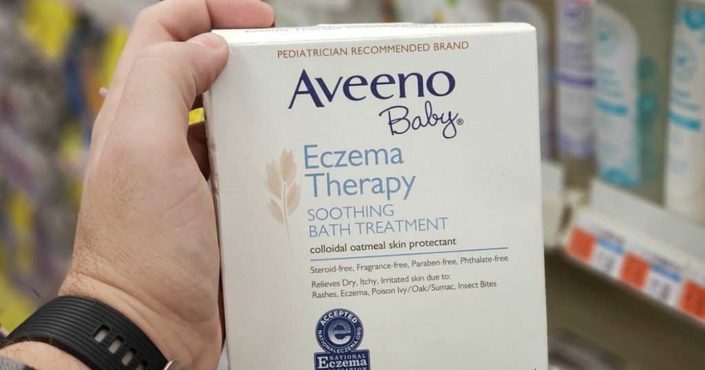 Aveeno Baby Eczema Therapy Soothing 10-Count Bath Treatment w_ Natural Colloidal Oatmeal in person's hand at store