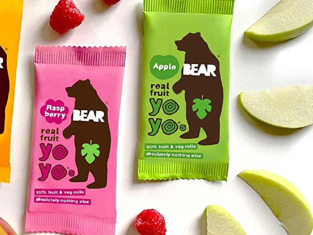BEAR raspberry and apple real fruit yo yo's with raspberry and apple slices scattered around the packages