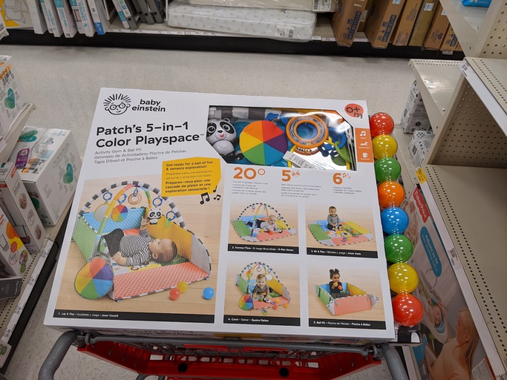 box of Baby Einstein Patch’s 5-in-1 Activity Play Gym and Ball Pit in target cart
