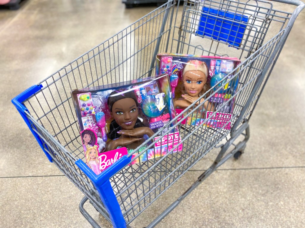 cart with 2 Barbie styling heads in it