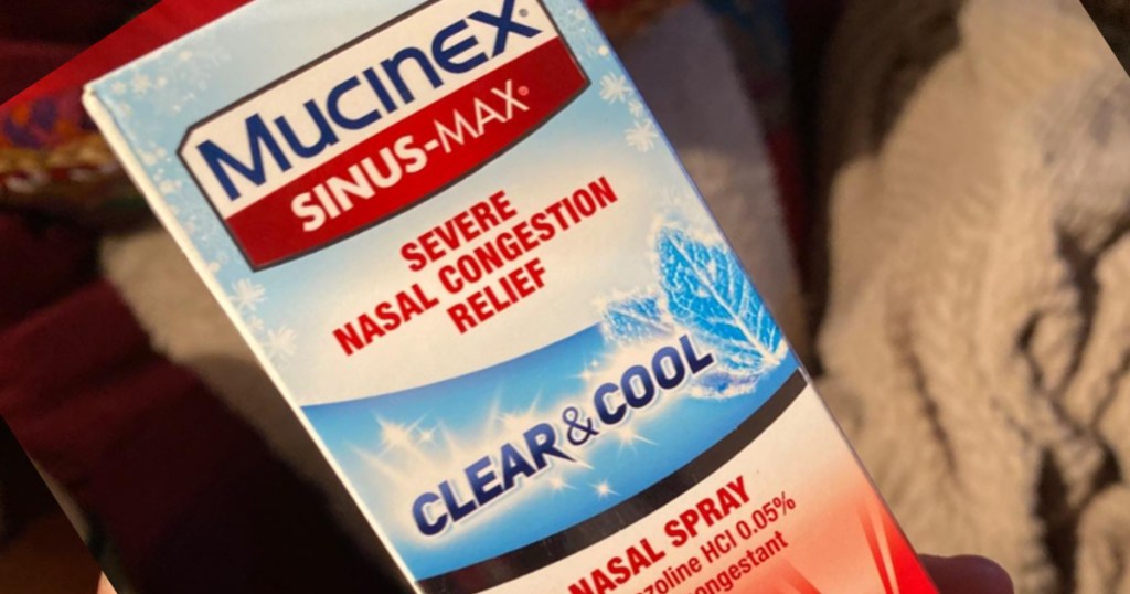 Mucinex clear and cool nasal spray in hand