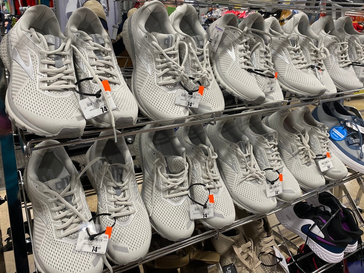 gray women's running shoes on store shoe displays