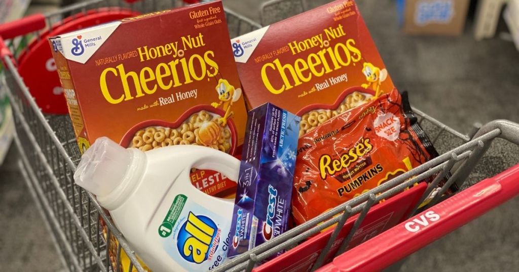 cereal, laundry detergent, toothpaste and candy in a CVS cart