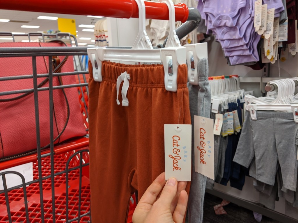 two pairs of Cat & Jack Baby Pull-On Jogger Pants in rust orange and grey