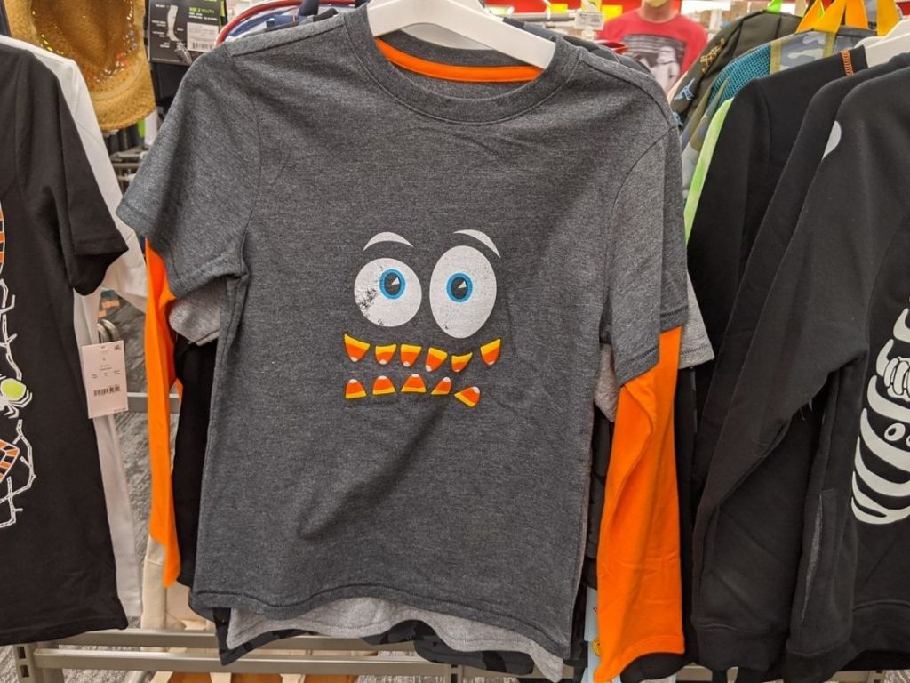 long sleeve kids t-shirt featuring crazy face with candy corn teeth